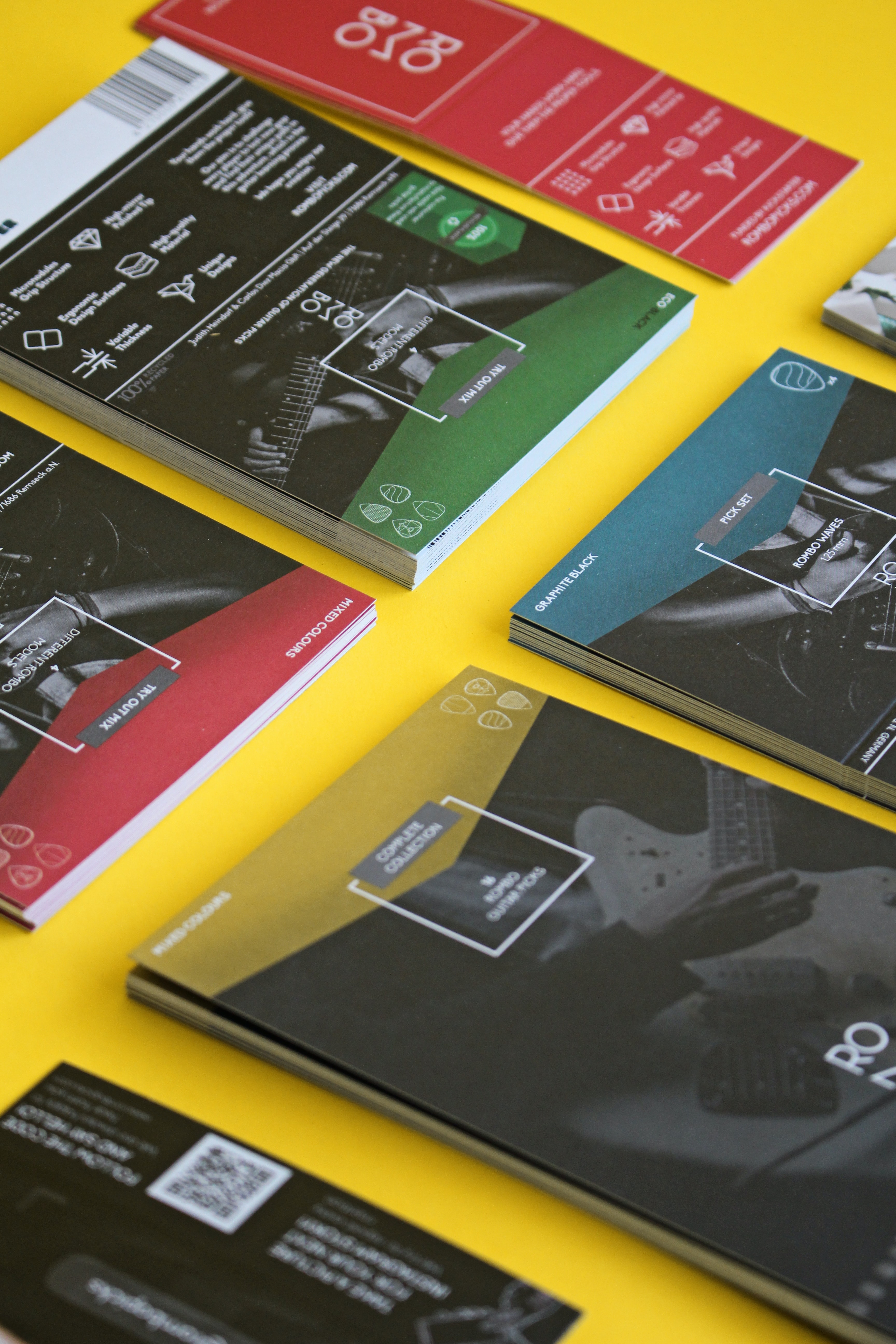 A row of brochures laid out on a yellow table
