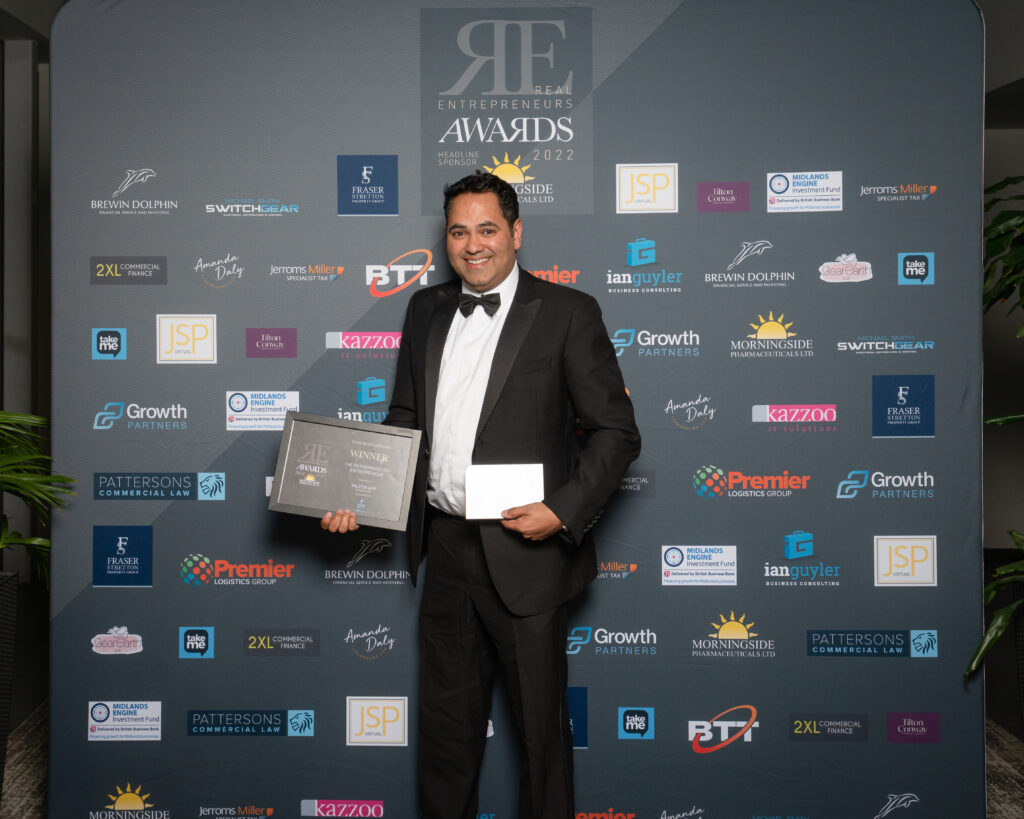 Saleem Arif winning an award at the Real Entrepreneurs' Awards