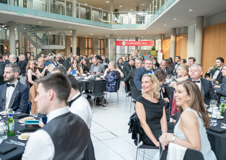 guests sit at tables at a business event