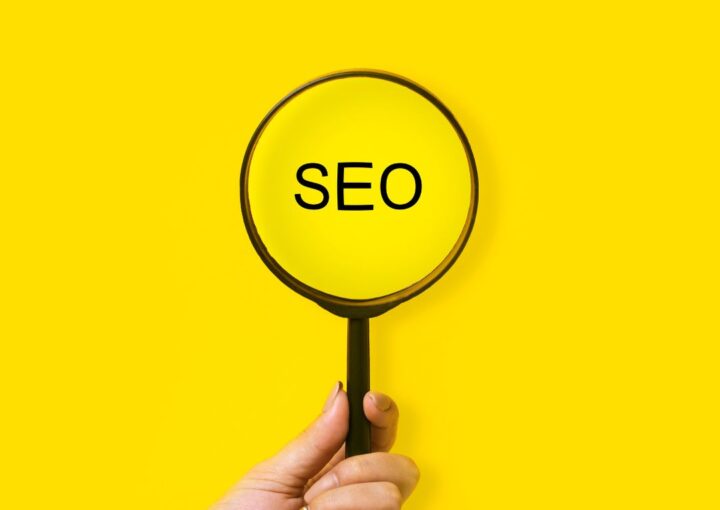 reason8 agency SEO magnifying glass on a yellow background